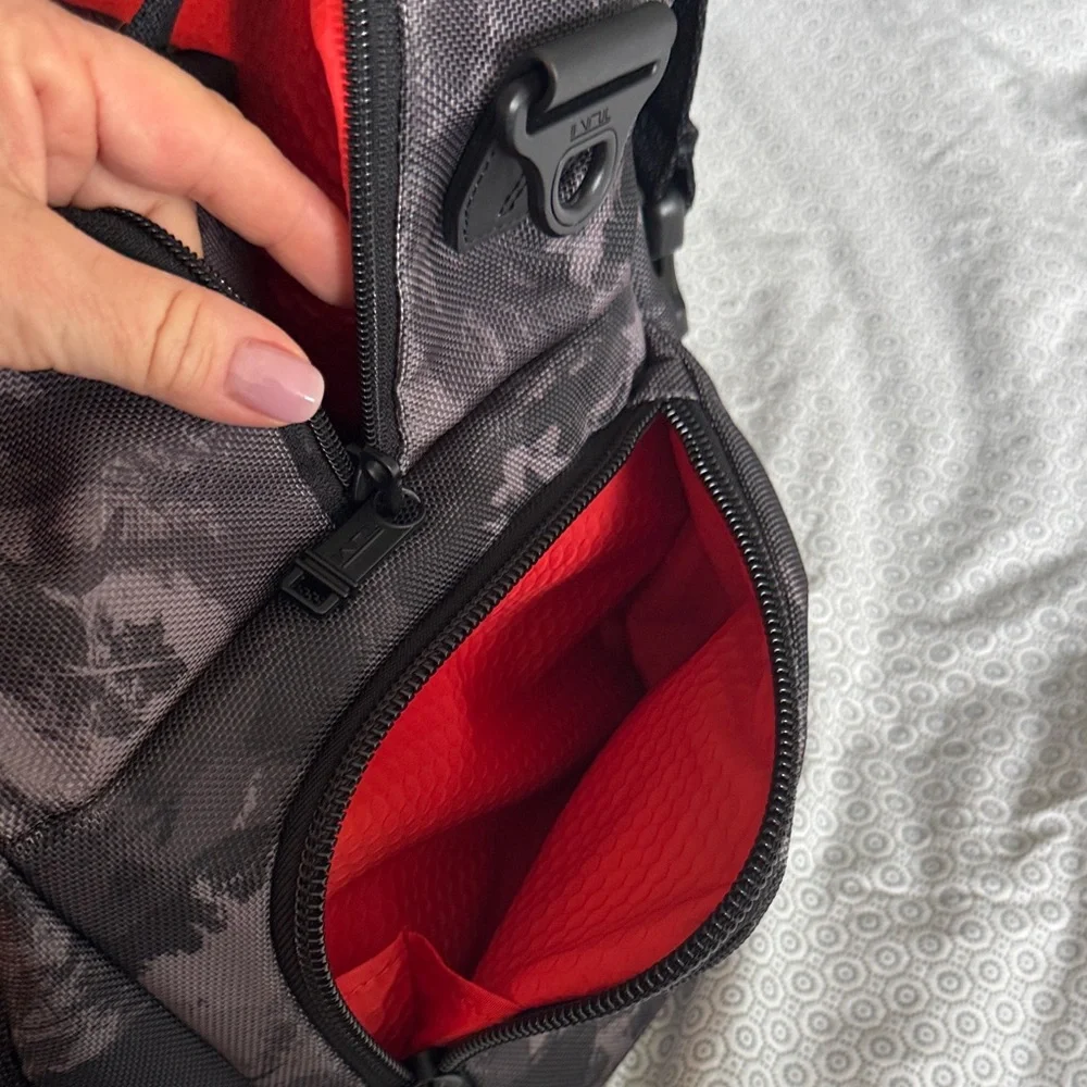Tumi Black Camo Duffel Bag with Red Interior